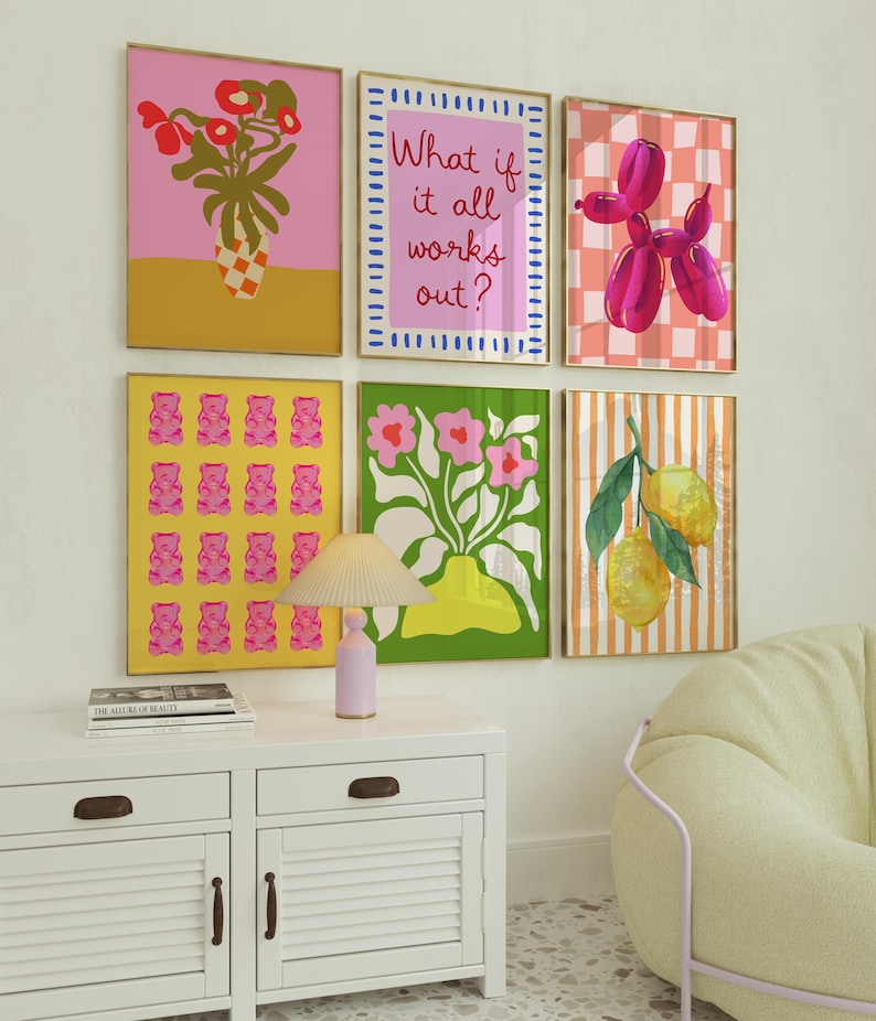 May include: Six framed art prints with vibrant designs. The prints feature a pink floral arrangement, the text "What if it all works out?", a pink balloon dog, pink gummy bears, a floral arrangement, and lemons.