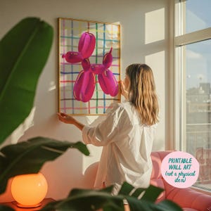 May include: A framed print featuring a magenta balloon dog illustration against a colorful plaid background. The artwork is displayed on a white wall. The text "Printable Wall Art (not a physical item)" is visible.