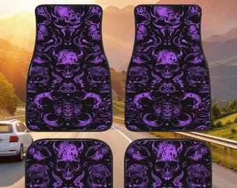 May include: Set of four custom car floor mats with a purple and black skull pattern. The mats feature a repeating design of skulls with horns and flames.