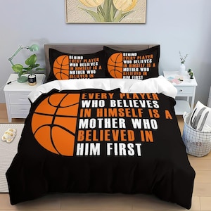 May include: Black and orange basketball themed bedding set with the text "Behind every player who believes in himself is a mother who believed in him first".