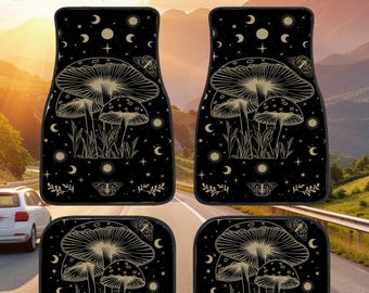 May include: Set of four black car floor mats with a gold mushroom and celestial design. The mats feature a repeating pattern of mushrooms, moons, stars, and butterflies.