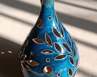 Blue Dragon Collection, handcrafted ceramic candle holder, fireplace model with openwork vine design.