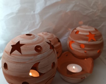 Handmade ceramic ball-shaped incense burner, decorated with stars and a plate for candles or for burning incense tablets.