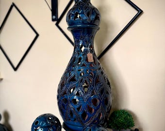 Handmade ceramic lamp in the Arabic style, shaped like a spinning top, made up of three pieces and with a ceramic holder installed for a light bulb.