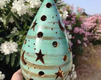 Ideal candle holder for centerpieces, Turquoise collection with star and moon cutouts.