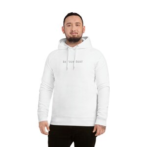 May include: White hooded sweatshirt with the text "BE YOUR BEST" printed on the front.