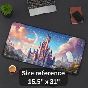 May include: A large rectangular mousepad featuring a fantasy castle scene with a blue and pink sky. The mousepad measures 15.5 inches by 31 inches and includes game play indicators such as "Lore", "Inkwell", "Draw", and "Discard".
