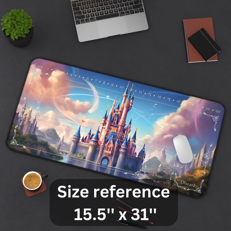 May include: A large rectangular mousepad featuring a fantasy castle scene with a blue and pink sky. The mousepad measures 15.5 inches by 31 inches and includes game play indicators such as "Lore", "Inkwell", "Draw", and "Discard".