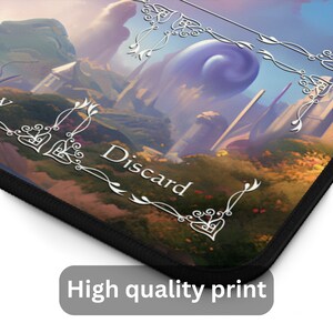 May include: A rectangular mousepad with a fantasy landscape design. The image features a vibrant, colorful scene with a purple orb, buildings, and the word "Discard" in white. The mousepad has a black border and the text "High quality print".