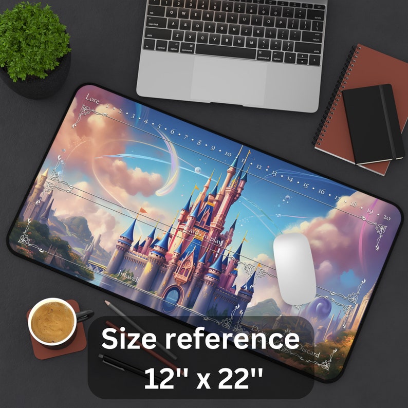 May include: A large rectangular mousepad featuring a fantasy castle scene with a blue and pink color scheme. The mousepad has a size reference of 12" x 22". A white mouse is on the pad, and a laptop and coffee cup are in the background.