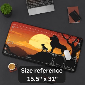 May include: A large rectangular mousepad with a sunset scene featuring two lions in silhouette. The mousepad has a black border and a white outline of a game board with the words "Lore", "Inkwell", "Cards in Play", "Draw", and "Discard". The mousepad measures 15.5 inches by 31 inches.