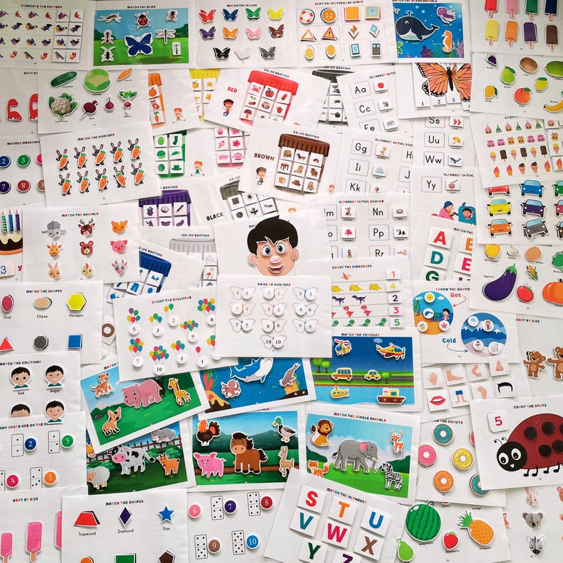 May include: A collection of colorful educational flashcards for children. The cards feature various themes, including colors, letters, numbers, shapes, and animals. The cards are designed to help children learn and develop their cognitive skills.