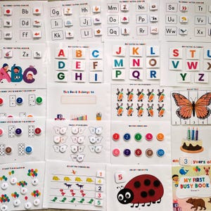 May include: A set of colorful educational flashcards for children. The cards feature the alphabet, numbers, and counting activities. The cards are designed to help children learn basic skills such as letter recognition, number identification, and counting.