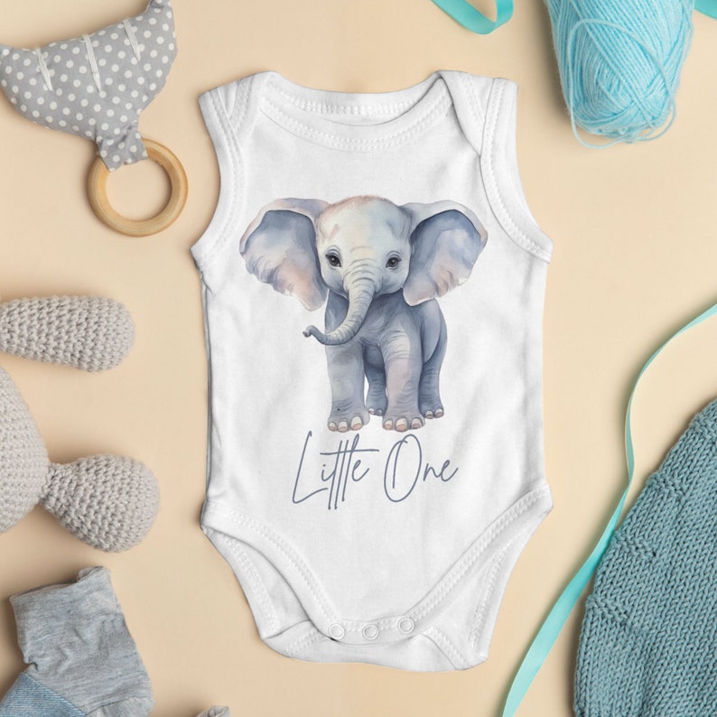 May include: White sleeveless baby onesie with a watercolor illustration of a gray elephant and the text "Little One" in purple.