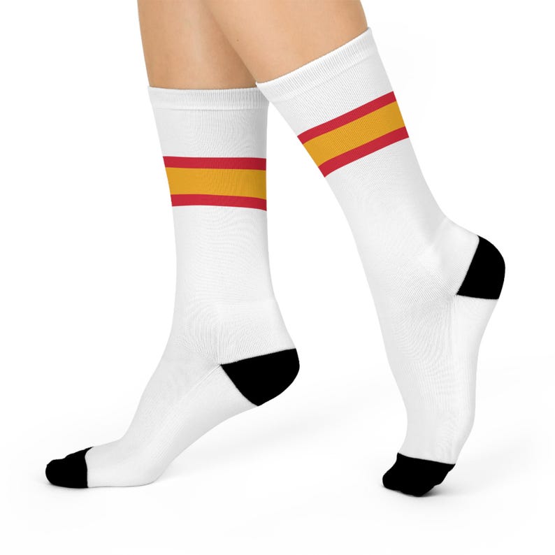 May include: White socks with a red and yellow stripe around the ankle.