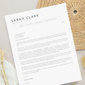 May include: A formal cover letter template with a simple design. The letter is addressed to a hiring manager and includes a professional salutation, a brief introduction, and a summary of the applicant's qualifications and experience. The letter concludes with a closing and the applicant's signature.