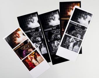 May include: Several black and white photo strips are arranged on a white surface. Each strip features three images of people at a party. The photos are in a vertical format with a white border. One strip has the text "Happy Birthday".