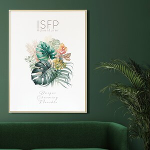 May include: A framed art print featuring a watercolor illustration of tropical leaves in shades of green, teal, and coral. The text "ISFP Adventurer" and "Unique, Charming, Flexible" are displayed in elegant fonts. The artwork is set against a white background.