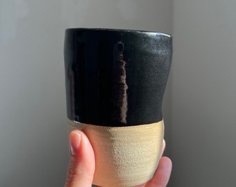 Black and natural clay cup