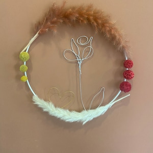 Wreath of dried flowers with symbol