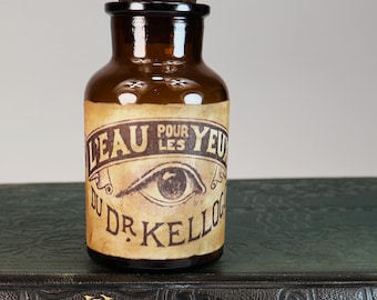 Vintage empty brown glass pharmacy bottle with decorative label "Dr. Kellogg's Eye Water"