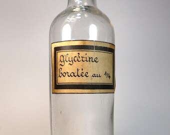 Old and empty glass pharmacy bottle, original label "Glycerin borate at 1/4"