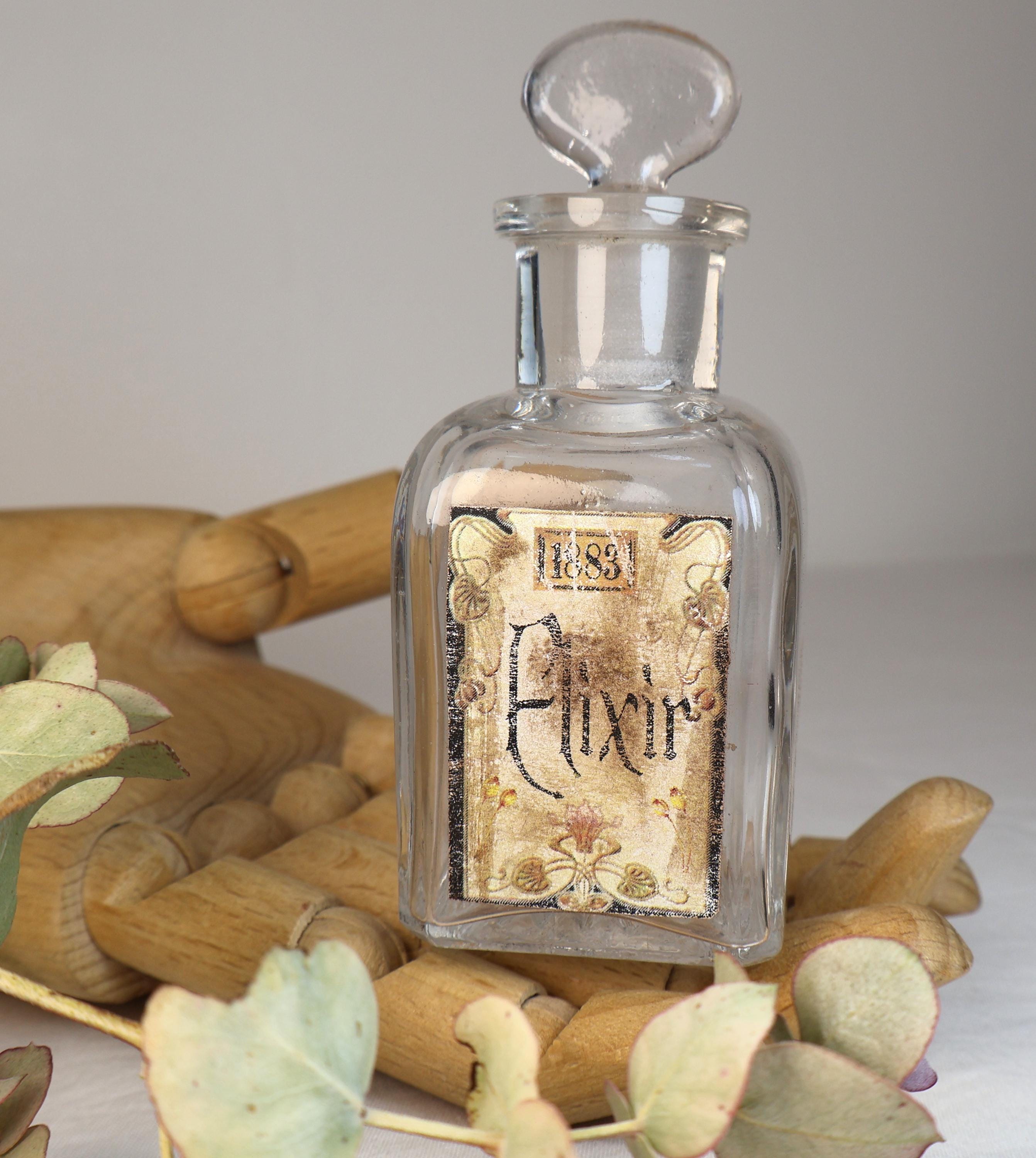 カスタム「エリクサー」ラベルデザインが施されたアンティークガラスの