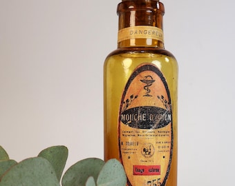Antique amber glass pharmacy bottle with custom "Opium Fly" label design