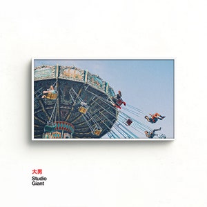 May include: A vintage carnival ride with colorful lights and people riding in suspended seats. The ride is against a bright blue sky.