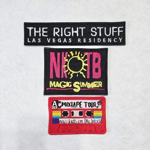 May include: Three rectangular embroidered patches. The top patch is black with white text reading THE RIGHT STUFF LAS VEGAS RESIDENCY. The middle patch is black with pink NKOTB text, a yellow sun icon, and yellow MAGIC SUMMER text. The bottom patch is a red cassette tape with rainbow accents and text reading A SIDE MIXTAPE TOUR new kids on the block.