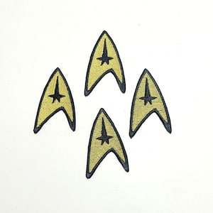 Puede incluir: Cuatro parches bordados con la insignia del Comando de la Flota Estelar de Star Trek. Cada parche tiene un fondo dorado, un borde negro y un diseño de estrella negra.