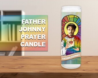 May include: A white prayer candle with a rainbow design and a picture of Johnny Depp as a saint. The text "Father Johnny" is printed on the candle.