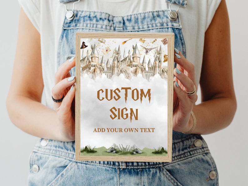May include: A printable sign with a watercolor illustration of Hogwarts castle. The sign has a brown wooden frame and says "Custom Sign" in brown text with a lightning bolt design. The text "Add your own text" is also included in brown text.
