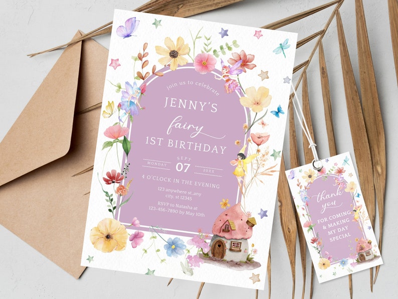 May include: A purple and white invitation with a watercolor illustration of a fairy house, flowers, and fairies. The text reads "Join us to celebrate Jenny's fairy 1st birthday, Monday, Sept 07, 4 o'clock in the evening, 123 anywhere stany, city, st 12345, RSVP to Natasha at 123-456-7890 by May 10th". A matching thank you tag with the text "Thank you for coming & making my day special" is also included.