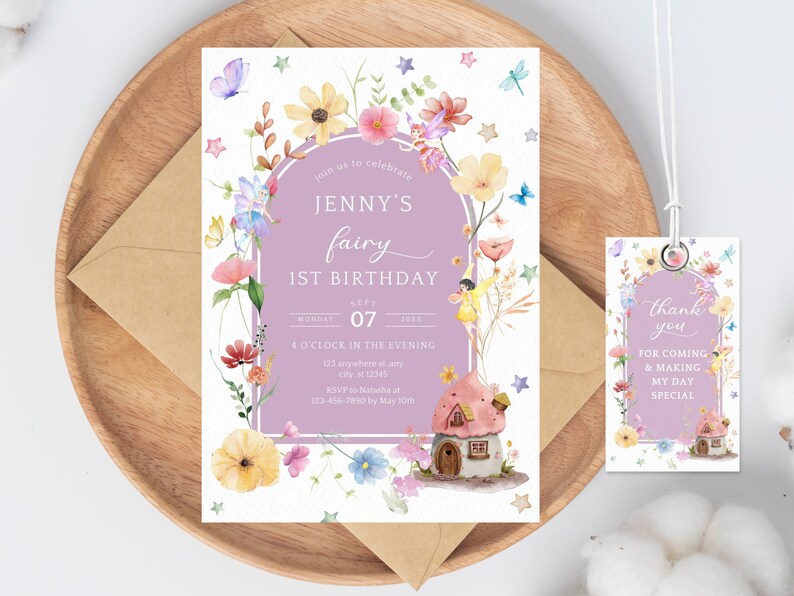 May include: A purple and white fairy-themed first birthday party invitation with a watercolor illustration of a fairy house, flowers, and fairies. The text reads "Join us to celebrate Jenny's fairy 1st birthday, Monday Sept 07, 4 o'clock in the evening, 123 anywhere st.ang, city 12345, RSVP to Natasha at 123-456-7890 by May 100%". A matching thank you tag with the same design and the text "Thank you for coming & making my day special" is included.