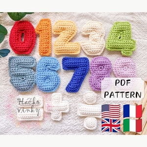 May include: Crochet pattern for numbers 0-9, plus and minus signs, and a division symbol. The pattern is available in PDF format and includes instructions in English, French, and Italian. The pattern is for crocheting colorful numbers and math symbols.