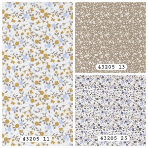 May include: Three fabric swatches featuring floral patterns. The left swatch has a white background with mustard yellow and light blue flowers. The top right swatch is beige with white flowers. The bottom right swatch is white with dark blue flowers.