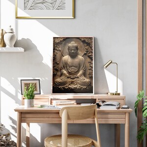 May include: A framed print of a brown stone Buddha statue sitting in meditation. The statue is surrounded by a carved floral design. The print is hanging on a white wall above a wooden desk with a chair.