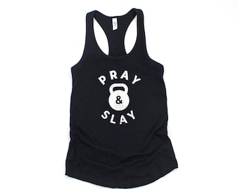 May include: Black tank top with a white graphic that says "Pray & Slay" with a white kettlebell icon.
