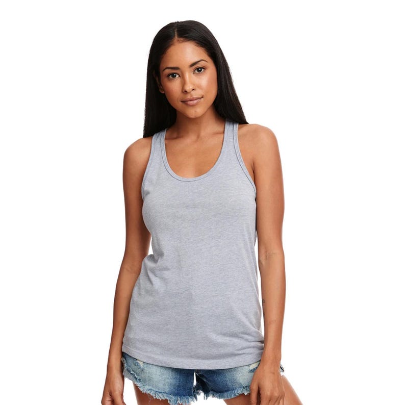 May include: A heather gray racerback tank top with a scoop neck. The tank top is made of a soft, comfortable fabric and is perfect for layering or wearing on its own.