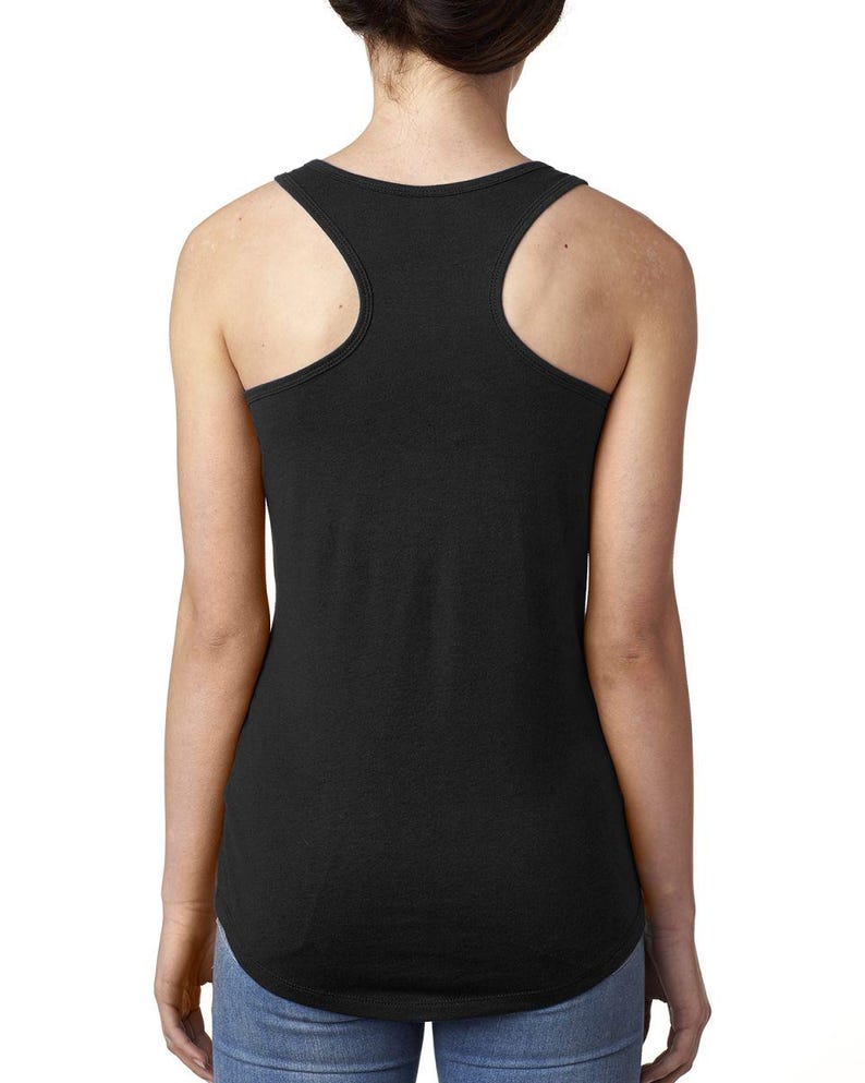 May include: A black racerback tank top with a relaxed fit. The tank top is made of a soft, comfortable fabric and has a slightly longer length in the back.