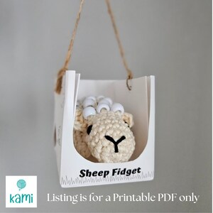 May include: A printable PDF pattern for crocheting a sheep toy with white beads for eyes. The pattern is called "Sheep Fidget" and is available for download.