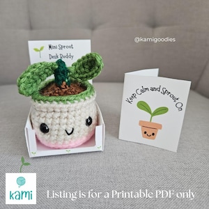 May include: A crocheted desk buddy in the shape of a plant, with a smiling face, green leaves, and a pink base. It comes with a card that says "Keep Calm and Sprout On". The product is a printable PDF.