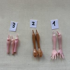 May include: A set of three ceramic mugs with a speckled, matte finish. The mugs are in shades of cream, light gray, and dark gray. Each mug has a simple, minimalist design, perfect for coffee or tea.