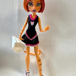 Monster High Doll Toralei Cheerleader, Authentic Mattel collectible doll, Monster High clothes and accessories,