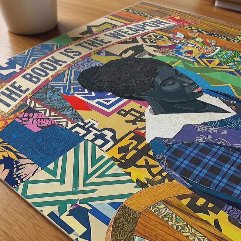 May include: A colorful artwork featuring a portrait of a person with dark skin, set against a vibrant patchwork of geometric patterns. The text "THE BOOK IS THE WEAPON" is displayed across the top. The artwork incorporates various colors and textures.