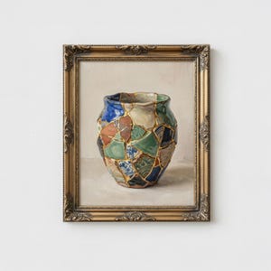 May include: A framed painting of a vase, showcasing the Japanese art of Kintsugi. The vase is composed of various ceramic fragments in shades of blue, green, brown, and white, joined with gold. The frame is ornate, with a gold finish.