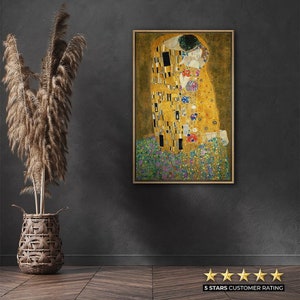 May include: A framed painting depicting a couple kissing. The painting is in a mosaic style with gold, black and white squares. The couple are wearing robes and are surrounded by flowers.