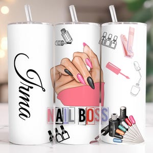 May include: White tumbler with a black and pink nail design, the words "Nail Boss" in colorful letters, and the name "Trina" written in black cursive.