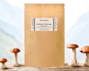 May include: A tan paper bag labeled "Wise Herbs Cordyceps 5x Stronger Extract Powder" with a white label. The bag is set against a backdrop of mushrooms and a blurred outdoor scene. The mushrooms have brown caps and white stems.